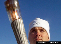 An actual Olympic torch at the 2002 games in Salt Lake City. Mitt Romney doled out a commemorative version now selling on eBay for hundreds, or thousands of dollars.