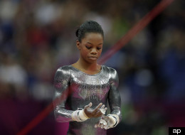 U.S. gymnast Gabrielle Douglas reacts after her performance on the uneven bars during the artistic gymnastics women's apparatus finals at the 2012 Summer Olympics, Monday, Aug. 6, 2012, in London.
