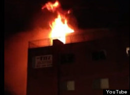 Flames visible from a fire that broke in the Fitz Apartment building in Aurora, Colo., near University of Colorado-Denver's Anschutz Medical Campus.
