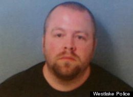Scott Smith, 37, was arrested Saturday night for allegedly bringing guns into a movie theater screening of