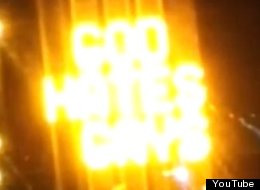 An illuminated roadside construction billboard allegedly posted in Provo, Utah appears to display the words 'God Hates Gays.'