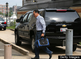 Republican presidential candidate Mitt Romney walks into his campaign headquarters in Boston on the morning of August 10, 2012. (Photo by Justin Sullivan/Getty Images)