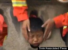 A Chinese boy had to be rescued after getting his head stuck in a stone guardrail.