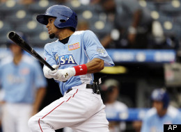 United States' Billy Hamilton hits a two-run triple during the third inning of the MLB All-Star Futures baseball game against the World in Kansas City, Mo.