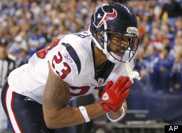 Houston Texans' Arian Foster reacts following a 9-yard touchdown run during the first half of an NFL football game against the Indianapolis Colts on Thursday, Dec. 22, 2011, in Indianapolis. (AP Photo/Michael Conroy)