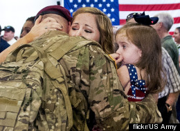 Caroline Scott welcomes home her husband, Army Sgt. Jerry Scott of the 82nd Airborne's 1st Brigade Combat team, Aug. 20. He served six months in Afghainstan. Photo by Sgt. Mike MacLeod, Flickr/U.S. Army