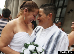 NEW YORK, NY - JULY 24: Maira Garcia (R) and Maria Vargas wait on line to get married at the Brooklyn City Clerk's office on July 24, 2011 in New York City. (Mario Tama/Getty Images)