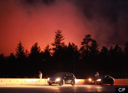 Wildfire burns out of control along highway 97C near Peachland, B.C. on Sunday Sept. 9, 2012. (Jeff Bassett, CP)
