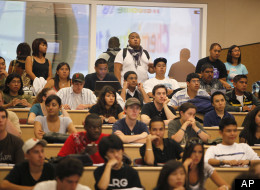 Students stand in the back row of a filled chemistry class at the California State University East Bay in Hayward, Calif., Wednesday, Sept. 23, 2009. Over 50 students were on a waiting list for the class. It isn't just tuition hikes driving up the cost of college. In cash-strapped California and around the country, deep budget cuts are trapping more college students in a kind of enrollment purgatory, where they're in school but can't get seats in the courses they need to move toward a degree. Th