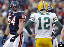 Chicago Bears linebacker Brian Urlacher (54) looks over at Green Bay Packers quarterback Aaron Rodgers (12) during the second half of the NFC Championship NFL football game Sunday, Jan. 23, 2011, in Chicago. (AP Photo/Jim Prisching)