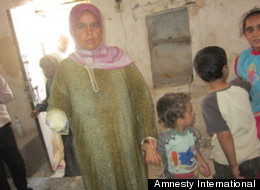 Maryam al-Sadd lost her right hand; her daughter, Rama Maklluta, was killed; and her son, Naji, 2, lost a finger when a 120mm mortar struck their home in Kfar Ruma, Syria, on July 25. (Amnesty International)