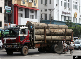 A truck loaded with teak logs runs on a road in Yangon, Myanmar, Thursday, Sept. 27, 2012.(AP Photo/Khin Maung Win)