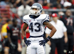 Connecticut running back Lyle McCombs stands on the field during the second half of an NCAA college football game against Rutgers in Piscataway, N.J., Saturday, Oct. 6, 2012. Rutgers won 19-3.