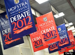 Signs are seen inside the media center as preparations continue October 14, 2012 for the second presidential debate at Mack Arena at Hofstra University in Hempstead, New York.(STAN HONDA/AFP/GettyImages)