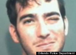 This is the face of a man accused of having sex on a restaurant table.