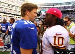 Eli Manning of the New York Giants meets Robert Griffin III of the Washington Redskins after the Giants 27-23 win at MetLife Stadium on October 21, 2012 in East Rutherford, New Jersey.