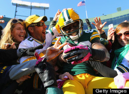 Donald Driver of the Green Bay Packers celebrates his touchdown against the Jacksonville Jaguars with a 'Lambeau Leap' at Lambeau Field on October 28, 2012 in Green Bay, Wisconsin.