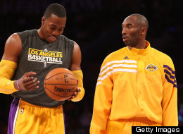 Dwight Howard and Kobe Bryant of the Los Angeles Lakers talks as they warm up to play the Sacramento Kings at Staples Center on October 21, 2012 in Los Angeles, California.