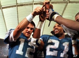 Detroit Lions quarterback Gus Frerotte (12) and running back Greg Hill (21), acknowledge the crowd after the Lions' 21-17 win over the Chicago Bears at the Silverdome in Pontiac, Mich., Thursday, Nov. 25, 1999.