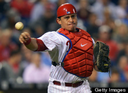 Carlos Ruiz #51 of the Philadelphia Phillies makes a throw to first base during the game against the Washington Nationals at Citizens Bank Park on September 25, 2012 in Philadelphia, Pennsylvania.