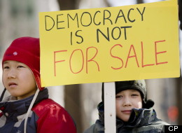Left-leaning advocacy group the Council of Canadians stands to gain nothing from a Federal Court case into allegations of voter-suppression tactics, other than to ensure that democracy is upheld, says a lawyer for eight voters challenging the results in six ridings. Pierre-Andre (7), left, and Ernest (5) Auclair attend a demonstration in Montreal, Sunday, March 11, 2012, protesting the 'Robocall', election fraud scandal. (CP)