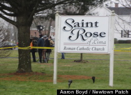 Tons of officials swarm St. Rose of Lima Church in Newtown Sunday following an anonymous threat that prompted an evacuation in the middle of a Mass. It was intended to honor the victims of Friday's shooting.