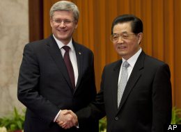 Canadian Prime Minister Stephen Harper meets with Chinese President Hu Jintao at the Great Hall of the People in Beijing, Thursday, Feb.9, 2012. (AP Photo/The Canadian Press, Adrian Wyld)