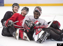 Team Canada teammates Dougie Hamilton, left, Anthony Camara, centre, and Malcolm Subban, right, ham it up for the cameras, pretending to bobsleigh during practice at the IIHF World Junior Championships in Ufa, Russia on Saturday, Dec. 29, 2012. THE CANADIAN PRESS/Nathan Denette