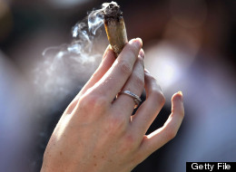 A woman holds a joint at a pro-marijuana '4/20' celebration in front of the state capitol building April 20, 2010 in Denver, Colorado.(Photo by John Moore/Getty Images)