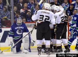 Vancouver Canucks' goalie Cory Schneider looks on the Anaheim Ducks celebrate a second-period goal on Saturday. (Rich Lam/Getty Images)