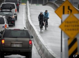 Cyclists rides across the new two-way bike lane separated from traffic on the Dunsmuir Viaduct in Vancouver in this March 10, 2010 file photo. One person has been killed and three others have been injured in a crash on the road (John Lehmann/Globe and Mail)
