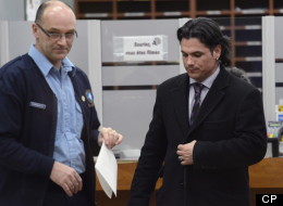 Sen. Patrick Brazeau leaves a courthouse in Gatineau, Que., after he was formally charged with assault and sexual assault Friday, Feb. 8, 2013. (CP/Adrian Wyld)